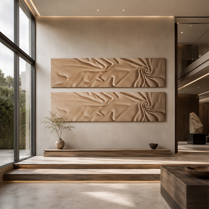 Pair of horizontal wall reliefs with soft draped folds in a matte sand tone, mounted above a wood bench in a contemporary interior